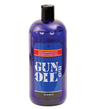 A blue plastic bottle of Gun Oil H2O water-based lubricant, featuring a black flip-top cap and a label displaying product information.