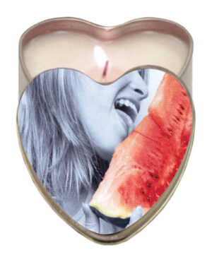 A whimsical heart-shaped candle featuring a playful image of a woman enjoying a slice of watermelon.