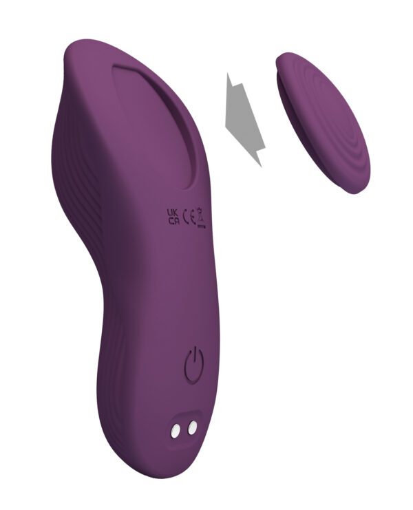 A purple ergonomic device with a detachable part, designed with simplicity and user comfort in mind.