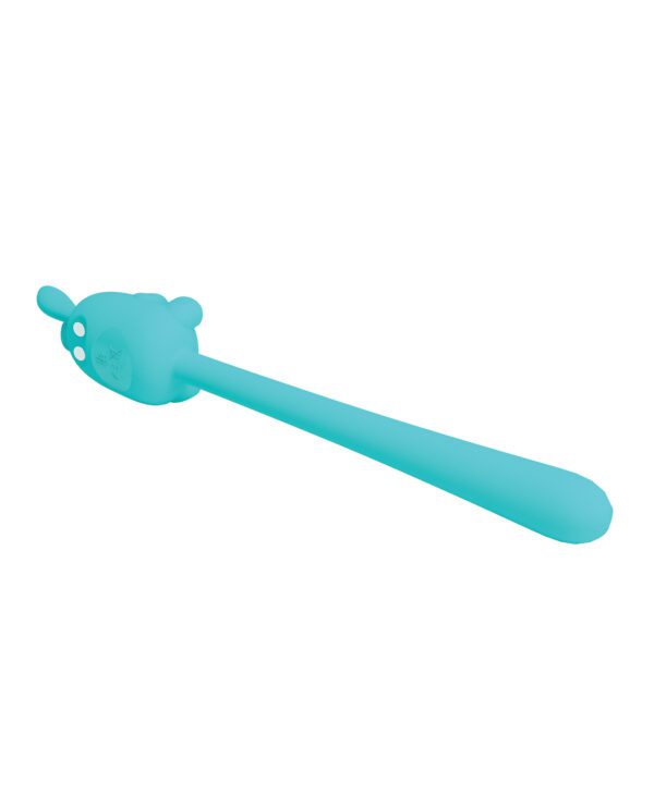 A turquoise baby spatula with an animal-shaped handle on a white background.