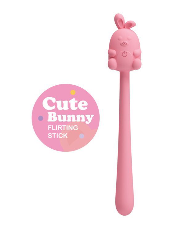 A pink stick with a cute bunny head and a button on the front, next to a circle logo with text "Cute Bunny FLIRTING STICK".