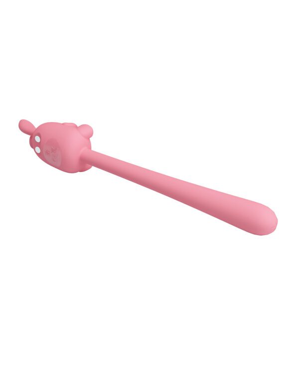 A pink spoon with a cartoon character design on the handle, isolated on a white background.