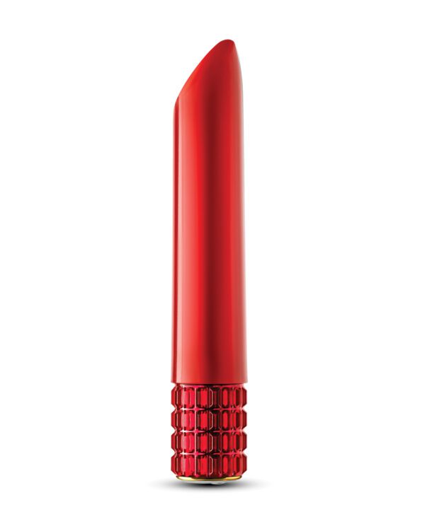 A single red lipstick with a luxurious case isolated on a white background