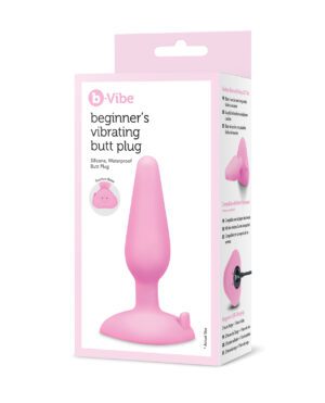 A pink beginner's vibrating butt plug displayed in its packaging.