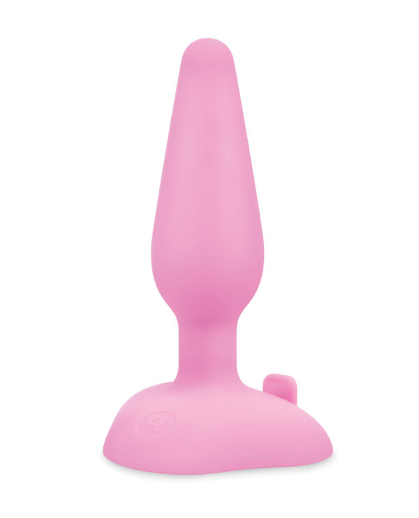 A pink silicone item with a tapered shape and flared base on a white background