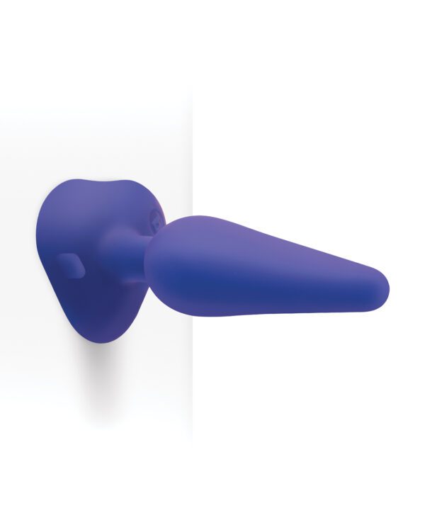 A blue silicone object with a dart-like shape against a white background