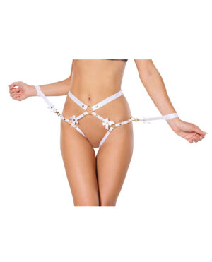 A model showcases a stylish white lingerie harness with gold accents and delicate bows, highlighting the intricate design around the waist and hips.