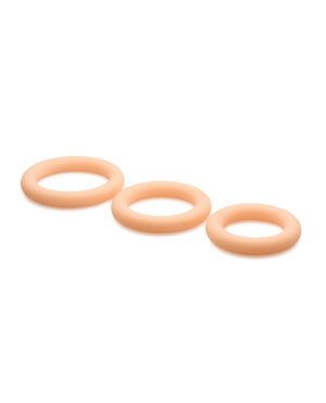 Three beige rubber bands arranged horizontally on a white surface.