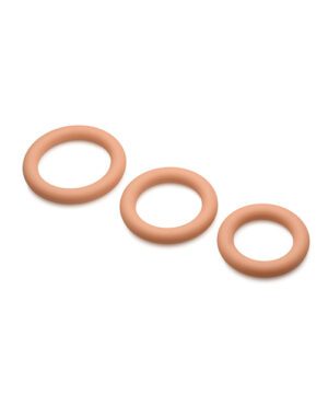 Three skin-colored rubber bands lying in parallel on a white background.