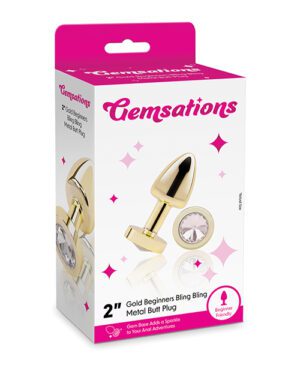 Box of adult novelty product with a gold-colored metal plug with gemstone detailing.