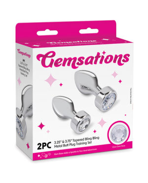 Packaging for GemSations 2-piece tapered metal butt plug set featuring clear gem bases and a playful design.