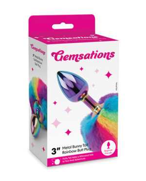 Packaging for a "Gemsations" 3-inch metal bunny tail rainbow butt plug displayed against a white background.