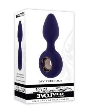 Product packaging for "My Precious" by Evolved, featuring an image of a dark purple silicone personal massager. The packaging is white with black and purple accents and text, emphasizing the silicone and rechargeable nature of the product.