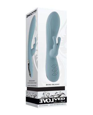 Product packaging for "BOSS BUNNY" by EVOLVED showing a blue silicone rechargeable personal massager next to its box, which has an image of the product, brand name, and product features listed.