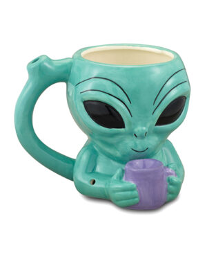 A novelty coffee mug shaped like an alien with big black eyes, holding a small purple cup, colored in shades of teal and cream.
