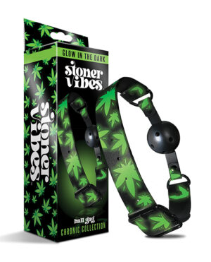 A product image featuring a glow-in-the-dark ball gag from the "Chronic Collection" with a green and black color scheme and marijuana leaf motifs, displayed next to its packaging box.