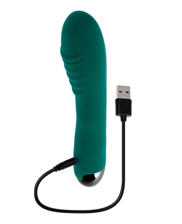 A green handheld personal massager with a USB charging cable attached, isolated on white background.