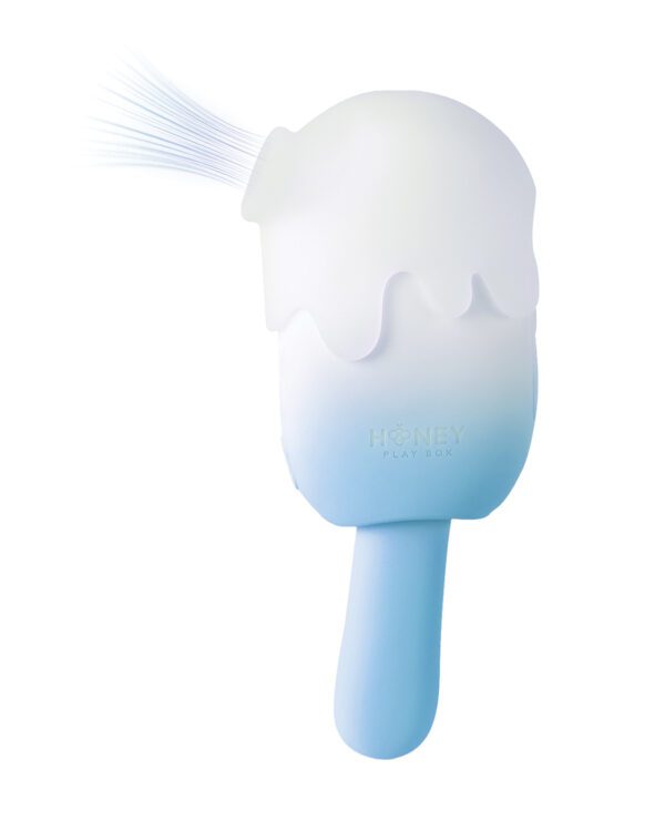 A silicone cleansing brush with a melting ice cream design in blue and white, featuring the text 'HONEY PLAY BOX'.