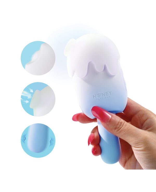 Hand holding a touch-responsive toy with branding, highlighted features, and a soft-edged design on a white background.