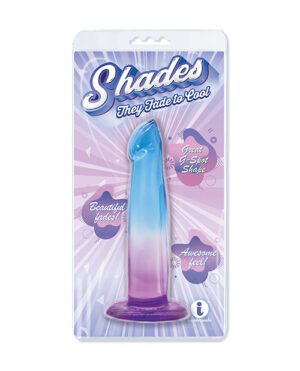 A product called "Shades" packaged in a clear plastic blister on a cardboard backing, featuring a blue to purple gradient dildo with text highlighting features such as "Great G-Spot Shape," "Beautiful fades!," and "Awesome feel!"