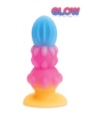 A colorful toy with stacked sections shaded blue, pink, and yellow, having a bulbous and textured design, with the text "GLOW in the dark" at the top.