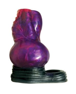 A purple and pink swirl glass sculpture with an abstract form resembling a heart, mounted on a black circular base.