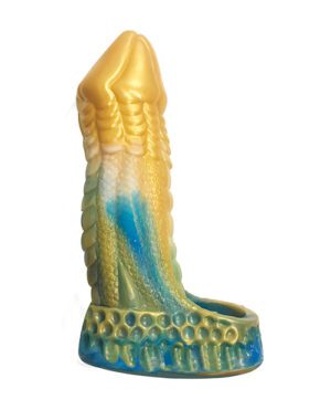 Alt text: A novelty candle shaped like a mermaid's tail, with intricate scales and a blend of colors including gold, green, blue, and cream, displayed against a white background.