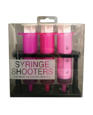A package containing six pink syringe-shaped shot glasses labeled "Syringe Shooters" with measurement markings and the tagline "Just what the doctor ordered!" displayed.
