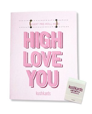 A greeting card from KushKards with the phrase "HIGH LOVE YOU" in pink letters and two slots to insert a pre-rolled item, accompanied by a small pack of matches.