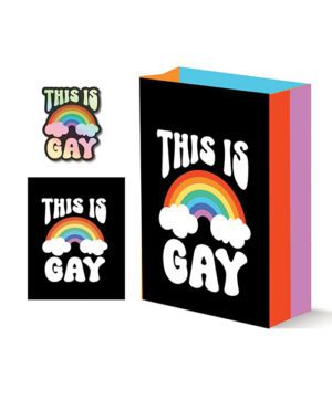 A shopping bag and two stickers with the phrase "THIS IS GAY" above a stylized rainbow and clouds on a black background. The bag has colorful sides.