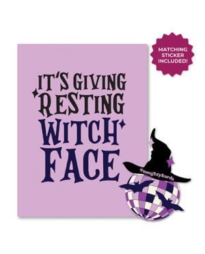 A purple greeting card with the phrase "It's Giving Resting WITCH FACE" in black letters and an illustration of a witch silhouette on a checkered pattern sphere, alongside a badge saying "MATCHING STICKER INCLUDED!"