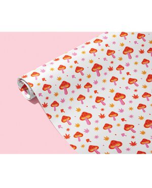 A roll of wrapping paper with a cute mushroom and star pattern on a pink background.