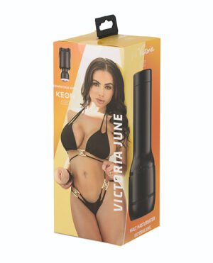 A product box featuring a woman in lingerie promoting an adult male masturbator, with a black device and text detailing compatibility with KEON system.