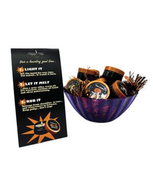 A spa gift basket with various bottles and promotional flyer on white background.