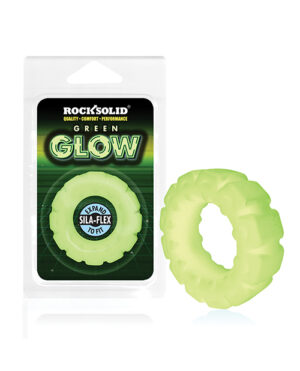 Glow-in-the-Dark Silicone Ring::A translucent green silicone ring displayed beside its packaging, labeled "Rock Solid Green Glow," highlighting its flexible and expandable features.