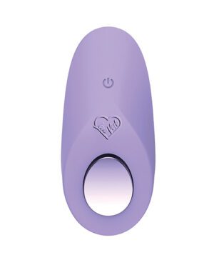 This is an image of a purple, oval-shaped device with a circular cutout in the center, a power symbol at the top, and a heart-shaped logo with the text "Fe-Vibe" above the cutout.