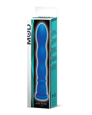 The image shows the packaging of a product named "MOD WAND" in a predominantly white box with turquoise design elements and a life-size image of the blue product on the front. The package features product information and branding.