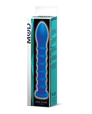 Alt text: The image shows a product packaging for a 'MOD Wand' personal massager. The box is predominantly white with teal and black accents, featuring a window through which the blue massager is visible. The package also includes text and icons indicative of the product's features.