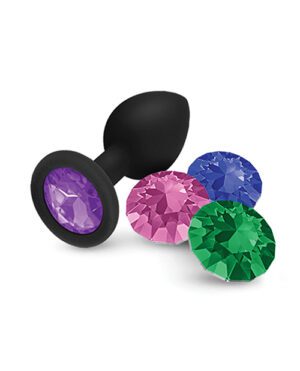 A black suction cup with a purple faceted gem-like attachment, displayed alongside similar items with pink, blue, and green gem attachments on a white background.