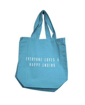 A blue tote bag with the phrase "EVERYONE LOVES A HAPPY ENDING" printed on it, isolated on a white background.