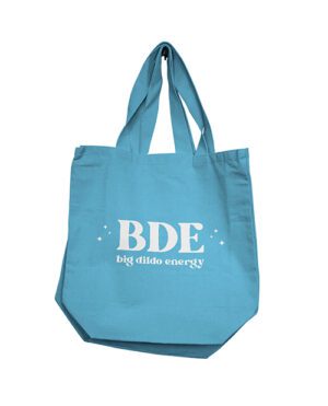 A blue fabric tote bag with the acronym "BDE" and the phrase "big dildo energy" printed on it.