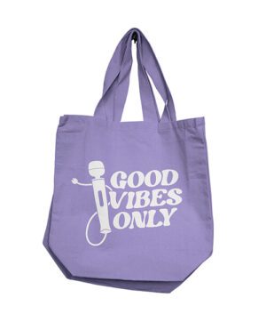 A purple tote bag with the words "GOOD VIBES ONLY" printed in white, featuring a graphic of a microphone.