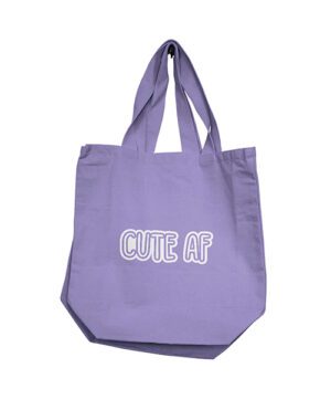 A lavender-colored tote bag with the phrase "CUTE AF" printed in white letters.