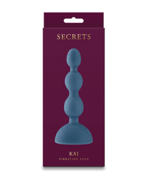 Product packaging for "SECRETS KAI Vibrating Plug" with a silhouette of the item against a dark red background.