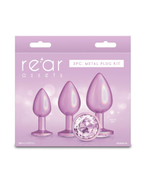 3-Piece Aluminum Plug Kit in Purple:::Packaging for a 3-piece metal plug kit featuring three tapered plugs and a decorative gem, designed for adult use.