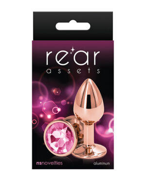 Elegant packaging for aluminum pleasure devices with rose gold accents and pink gem details.