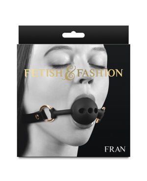 Packaging showing a black and white image of a woman's lower face with a black ball gag, labeled "FETISH & FASHION" in golden text, with "FRAN" at the bottom.