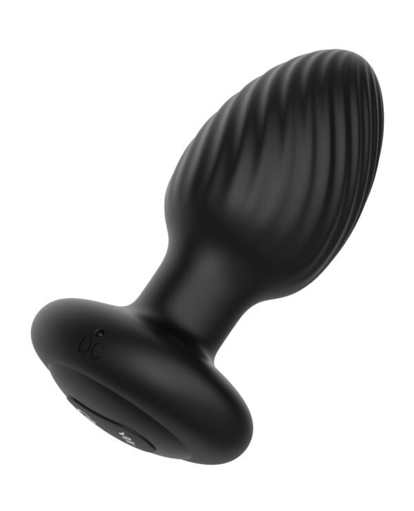 A black, ergonomic silicone massager with rippled design and power button visible at the base