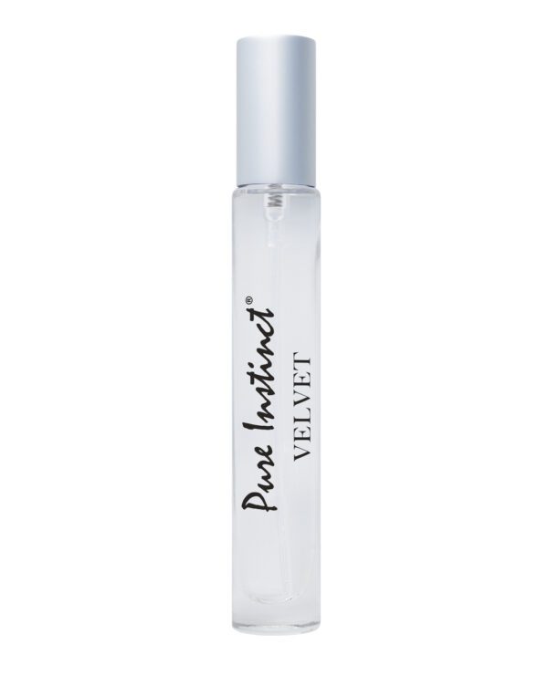 Clear glass roller bottle with Pure Instinct Velvet label on white background.