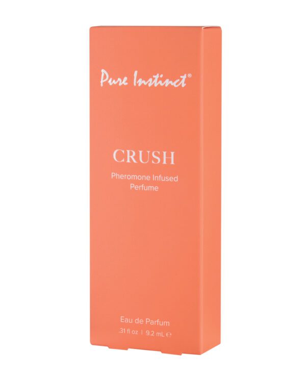 Orange perfume box labeled "Pure Instinct CRUSH Pheromone Infused Perfume Eau de Parfum .31 fl oz | 9.2 mL"